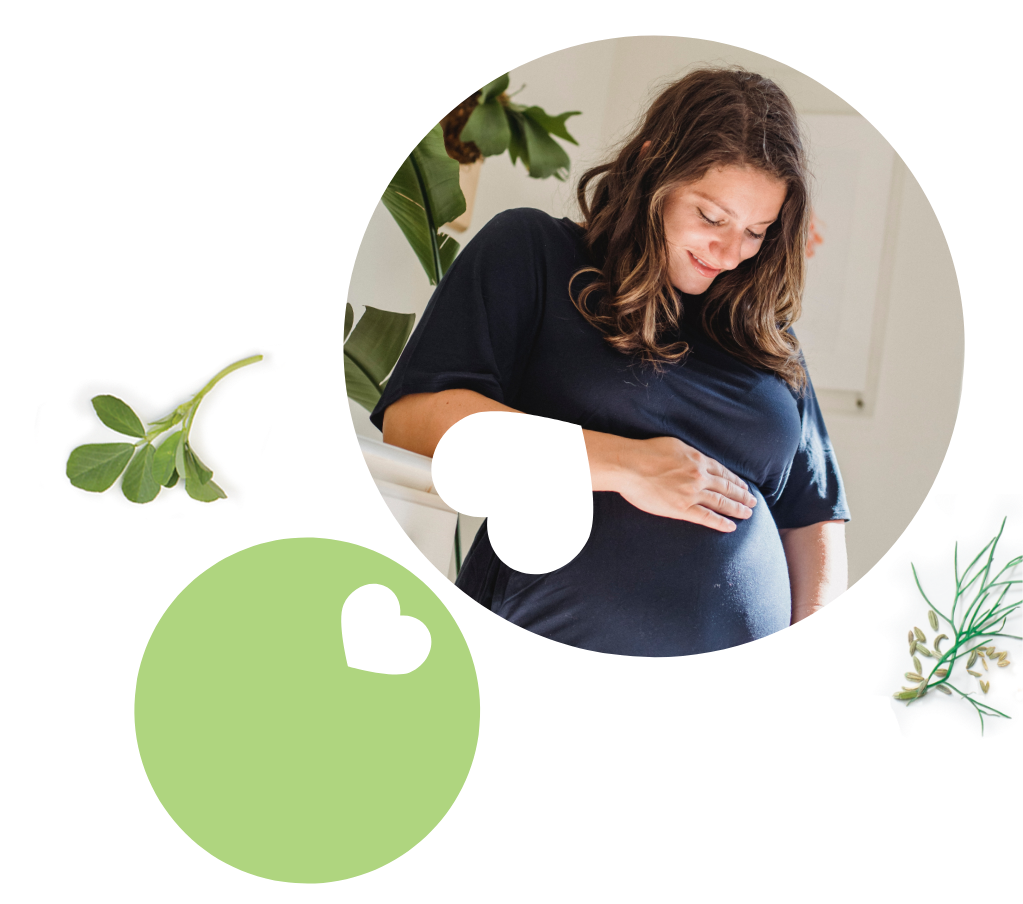A woman holding her pregnancy bump. She feels supported in pregnancy with UpSpring products.