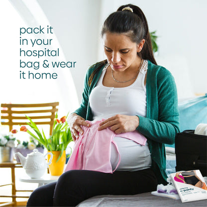 A pregnant person packing their hospital bag with UpSpring post baby panties