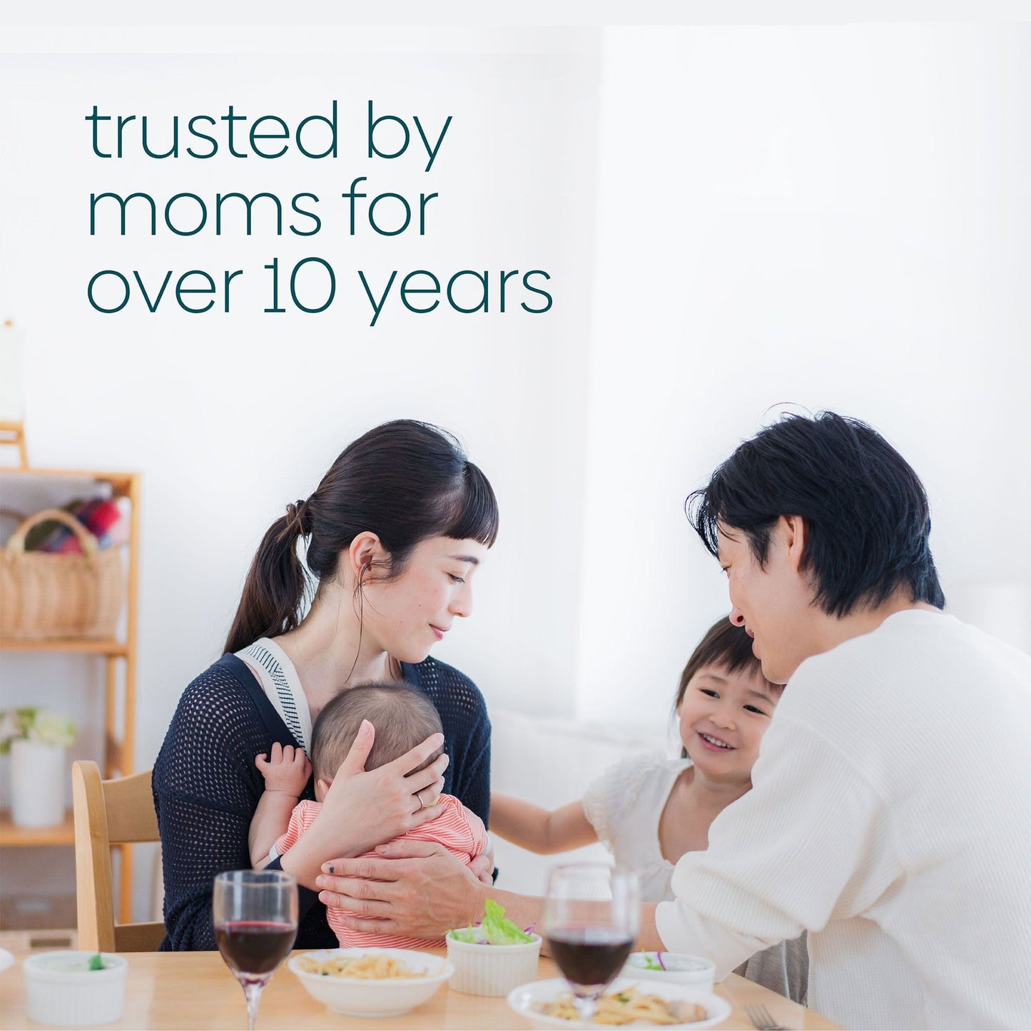 A mother and father with two young children enjoy a glass of wine knowing they trust Milkscreen